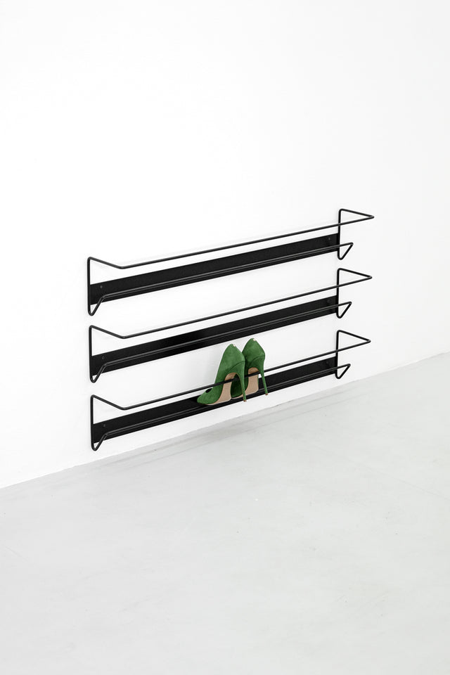 Result Objects wall mounting AIRO shoe racks in black with green high-heels
